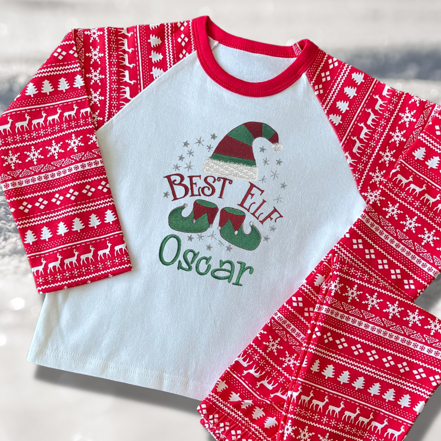 Personalised Embroidered Christmas Childrens Pyjamas and Rompersuits with a Cute 'Best Elf' Christmas Design
