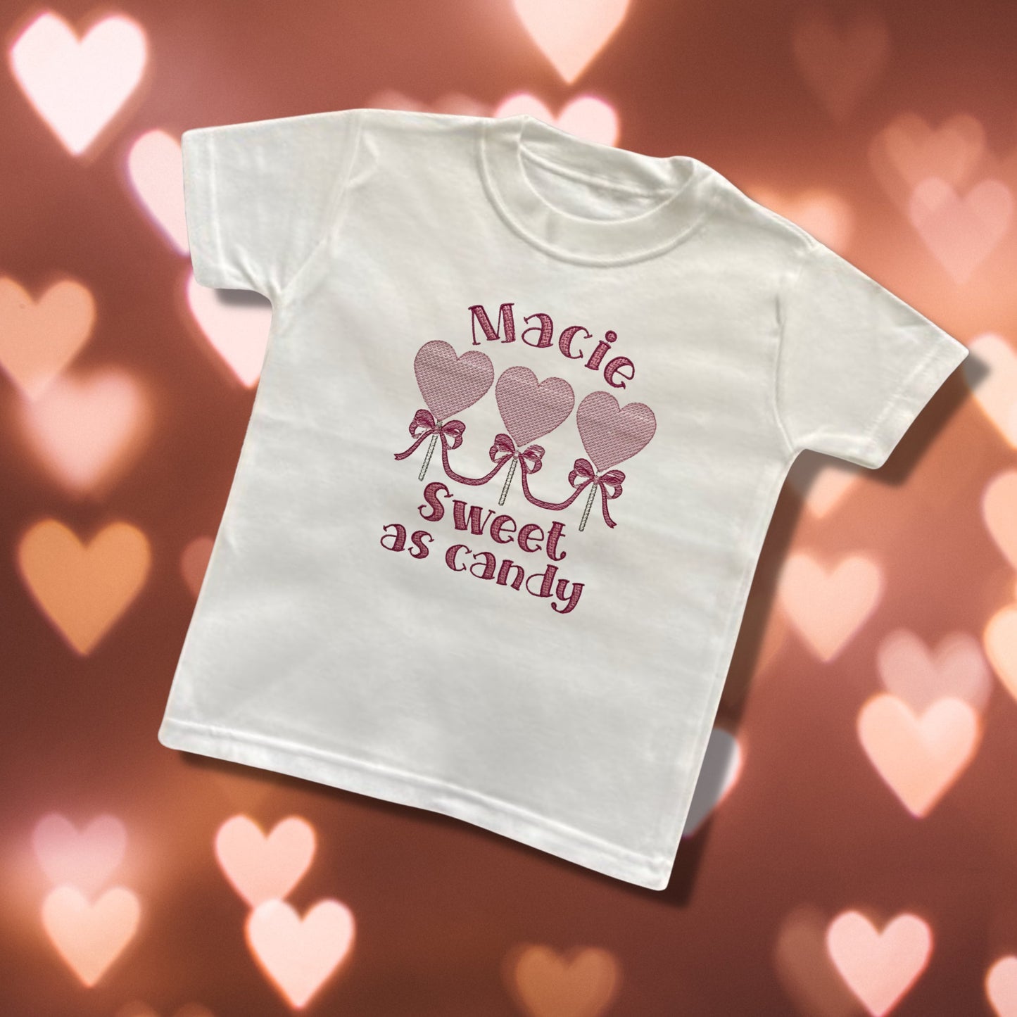 Embroidered Childrens Valentine's Shirt. Cute Row of Lollipop Hearts Saying 'sweet as candy' and Personalised with Child's Name.