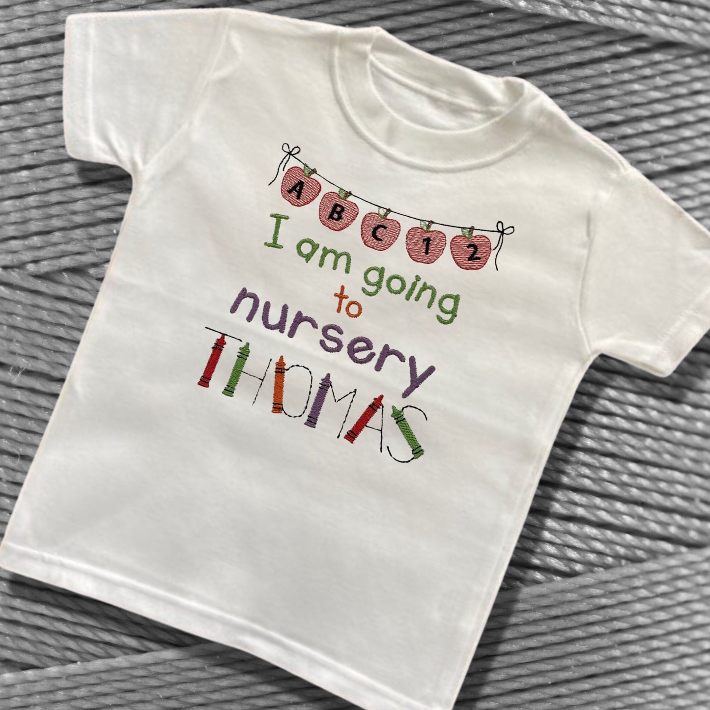 Personalised Embroidered 'I am going to nursery' Tops. Personalised with Child's Name in a Cute Colourful Crayon Font. Choice of Garment