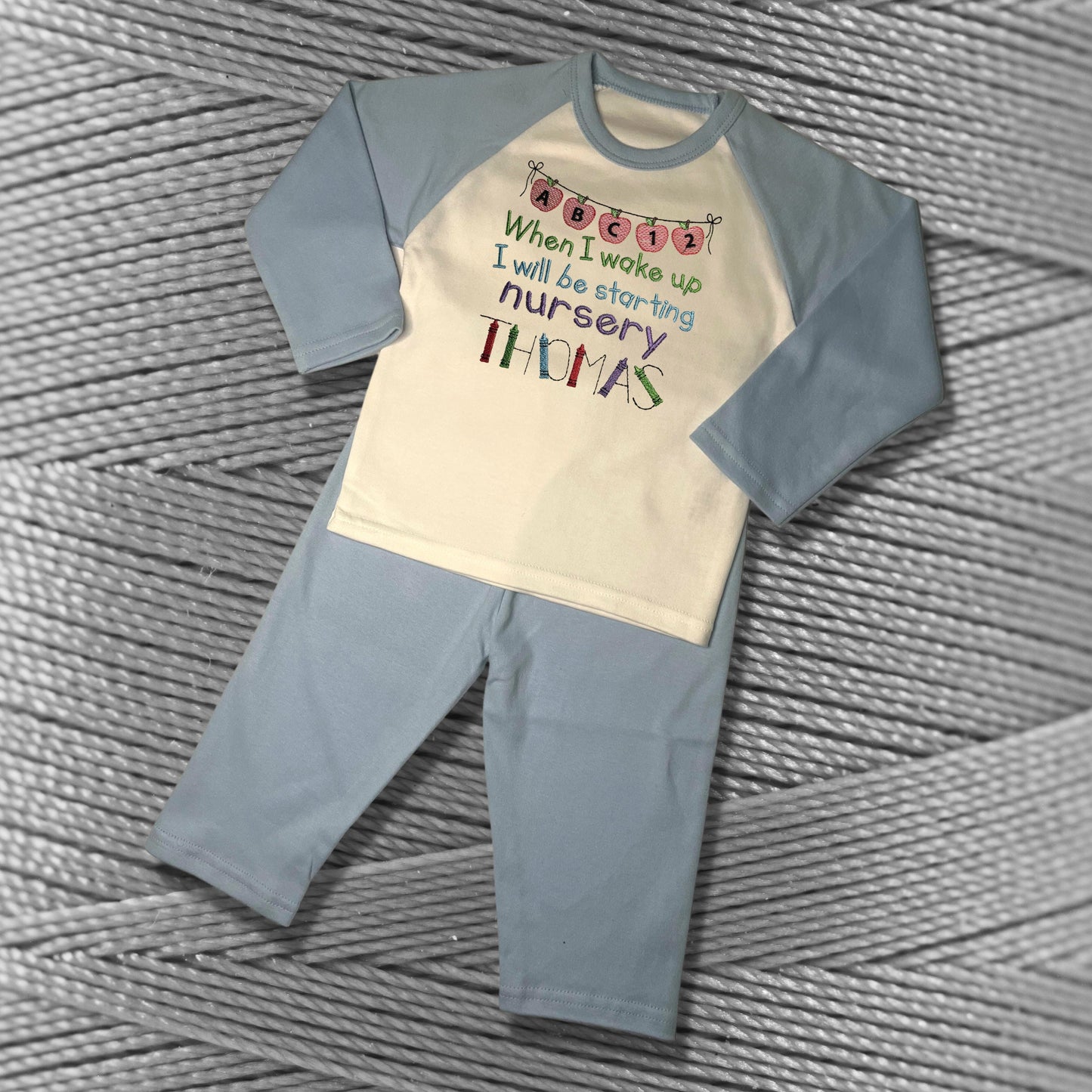 Childrens Personalised Embroidered Pyjamas Saying 'When I wake up I will be starting Nursery'. Cute Apple Banner Design with Child's Name.
