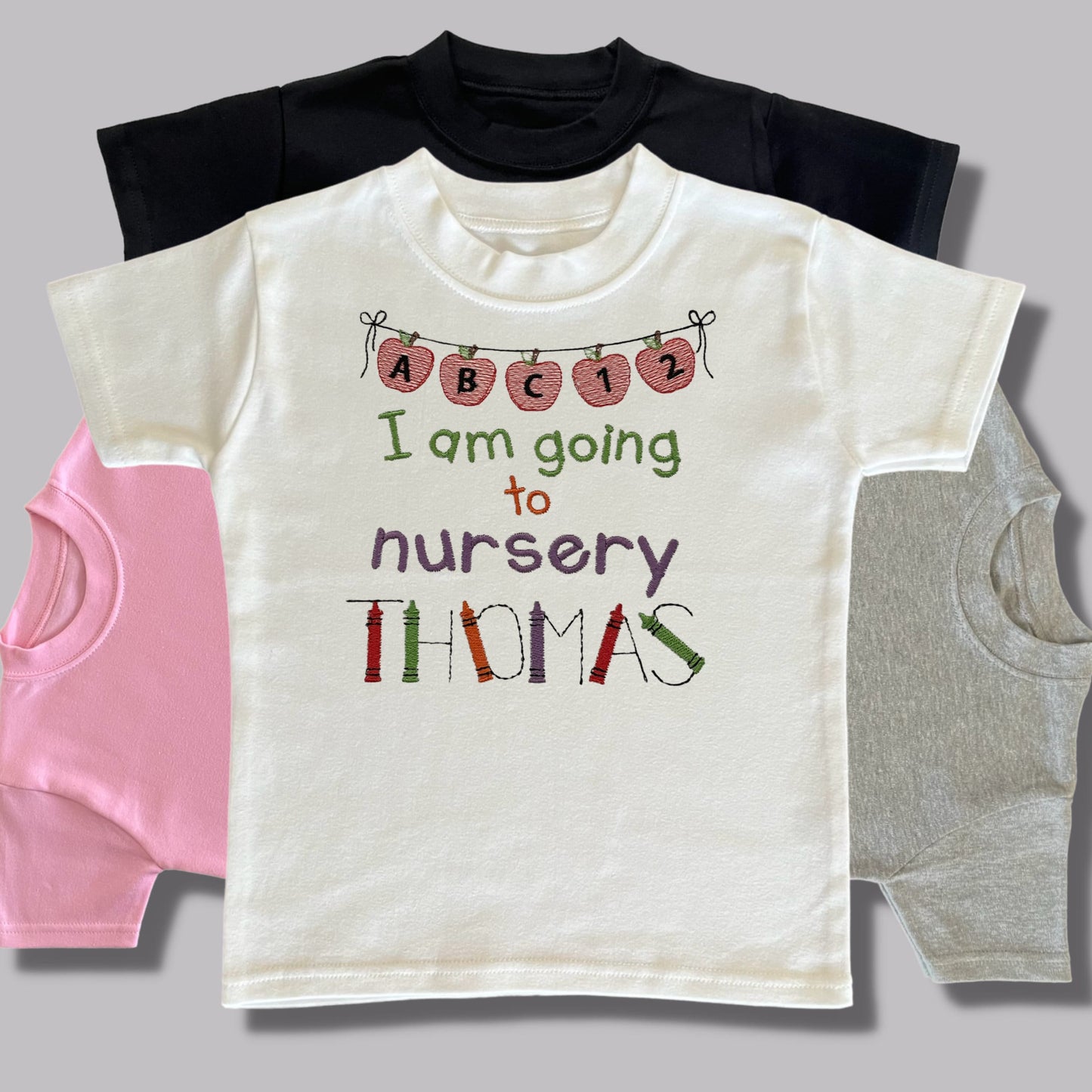 Personalised Embroidered 'I am going to nursery' Tops. Personalised with Child's Name in a Cute Colourful Crayon Font. Choice of Garment