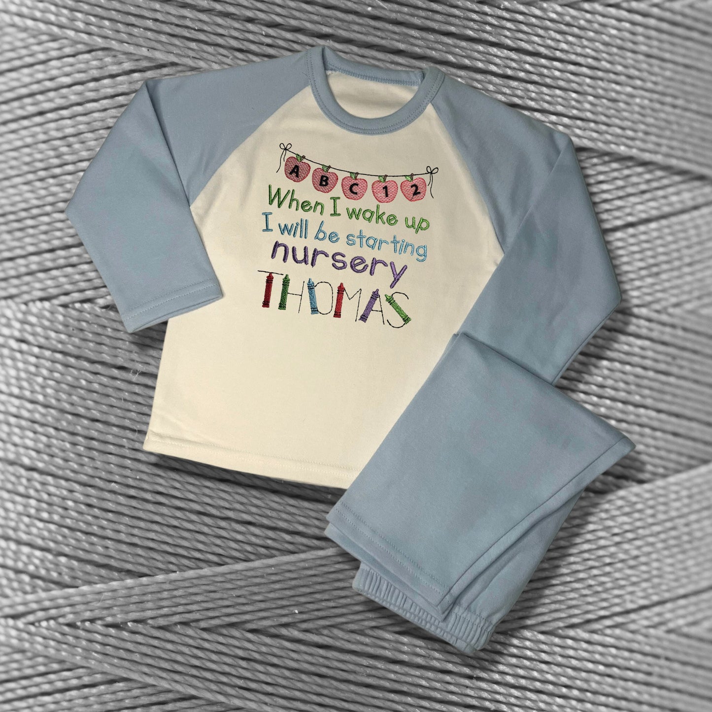 Childrens Personalised Embroidered Pyjamas Saying 'When I wake up I will be starting Nursery'. Cute Apple Banner Design with Child's Name.