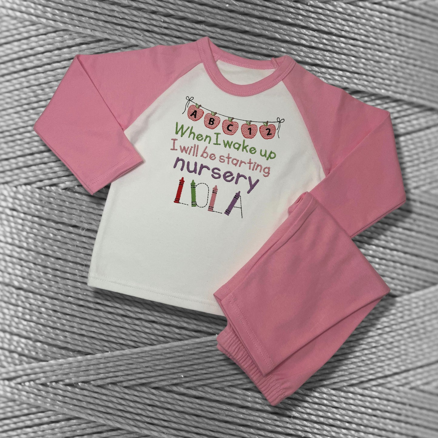 Childrens Personalised Embroidered Pyjamas Saying 'When I wake up I will be starting Nursery'. Cute Apple Banner Design with Child's Name.