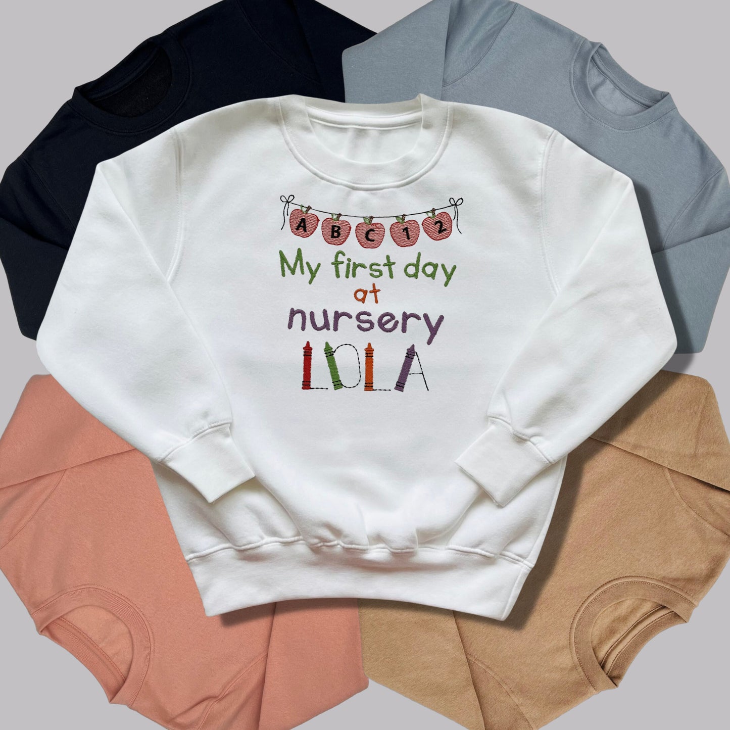 Personalised Embroidered 'My first day at nursery' Tops. Personalised with Child's Name in a Cute Colourful Crayon Font. Choice of Garment
