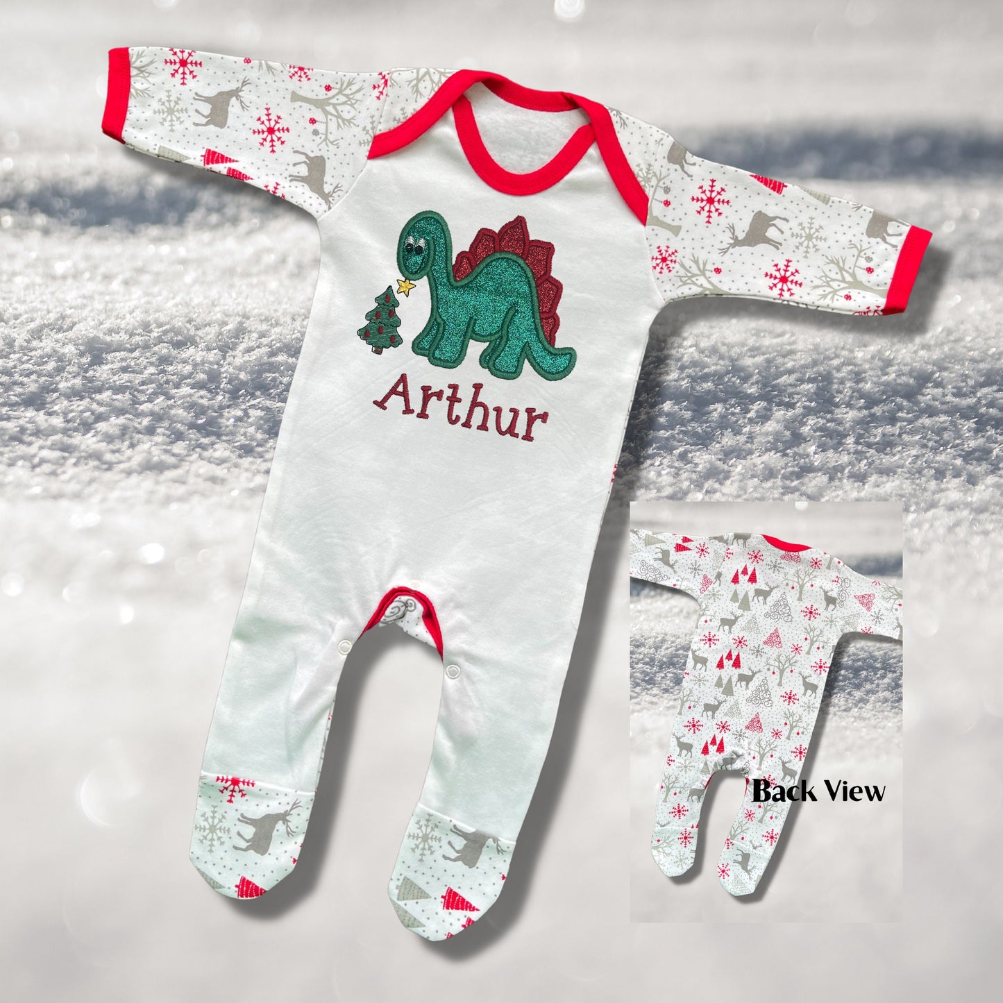 Personalised Embroidered Christmas Childrens Pyjamas and Rompersuits. Cute Dinosaur Putting a Star on his Tree. Finished with Child's Name