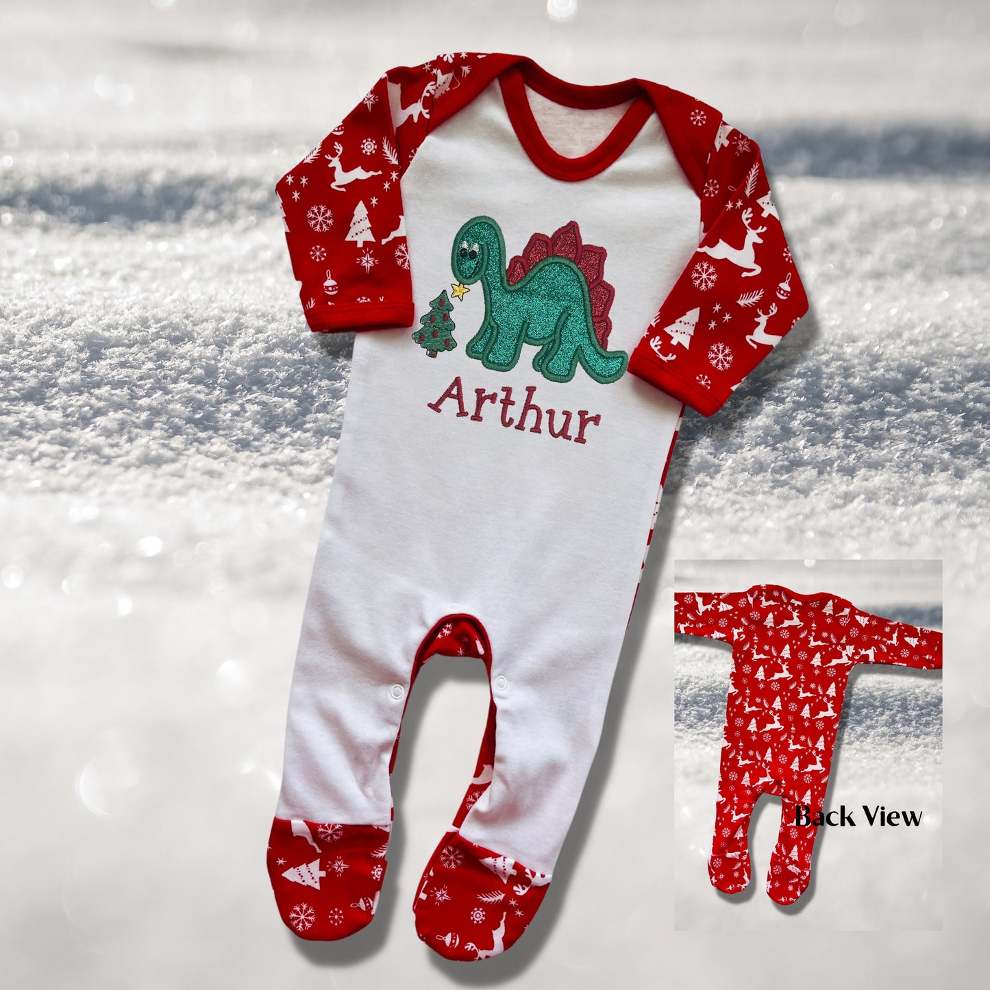Personalised Embroidered Christmas Childrens Pyjamas and Rompersuits. Cute Dinosaur Putting a Star on his Tree. Finished with Child's Name