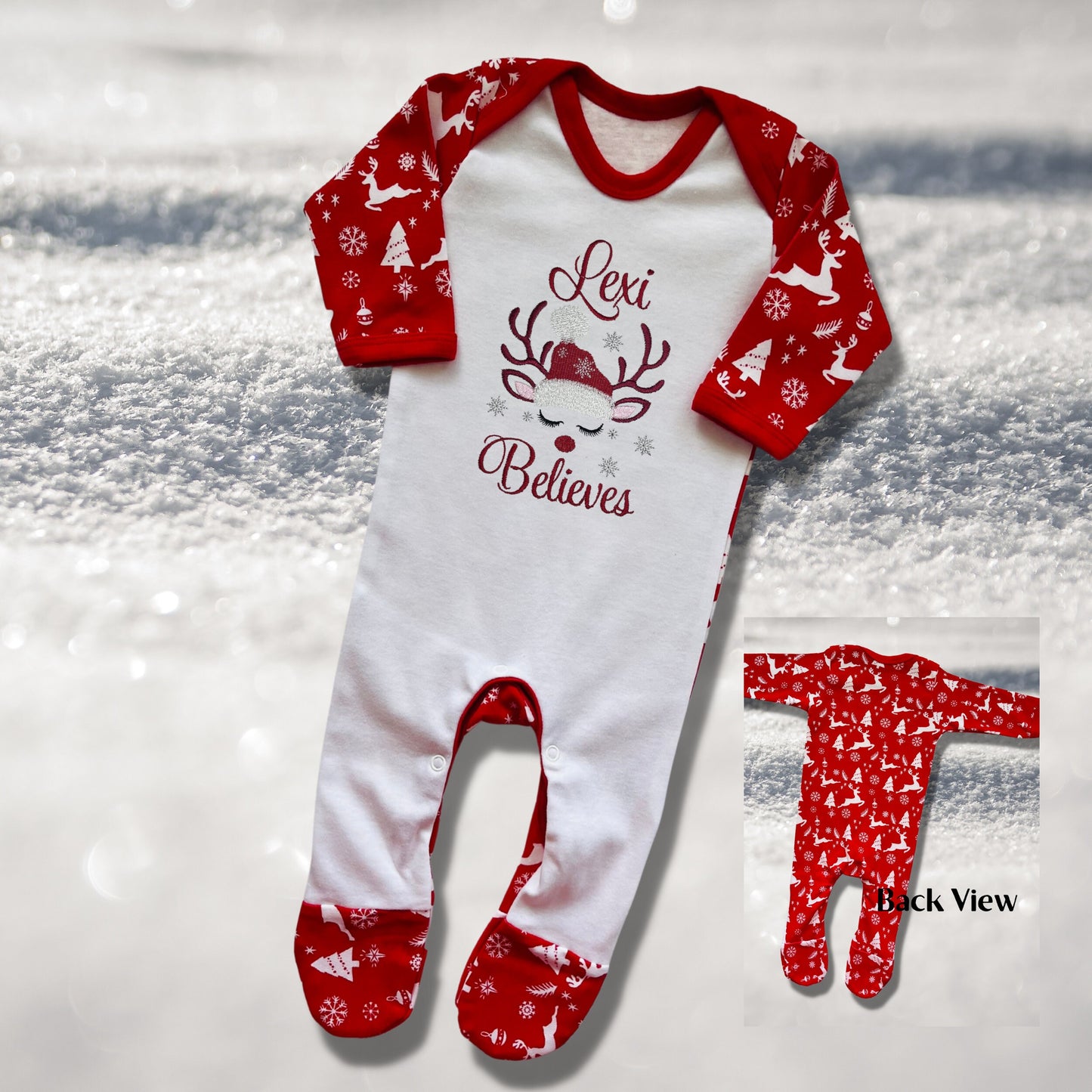 Personalised Embroidered Christmas Childrens Pyjamas and Rompersuits with a Gorgeous Winter Reindeer and the Words 'Believes' under the Name