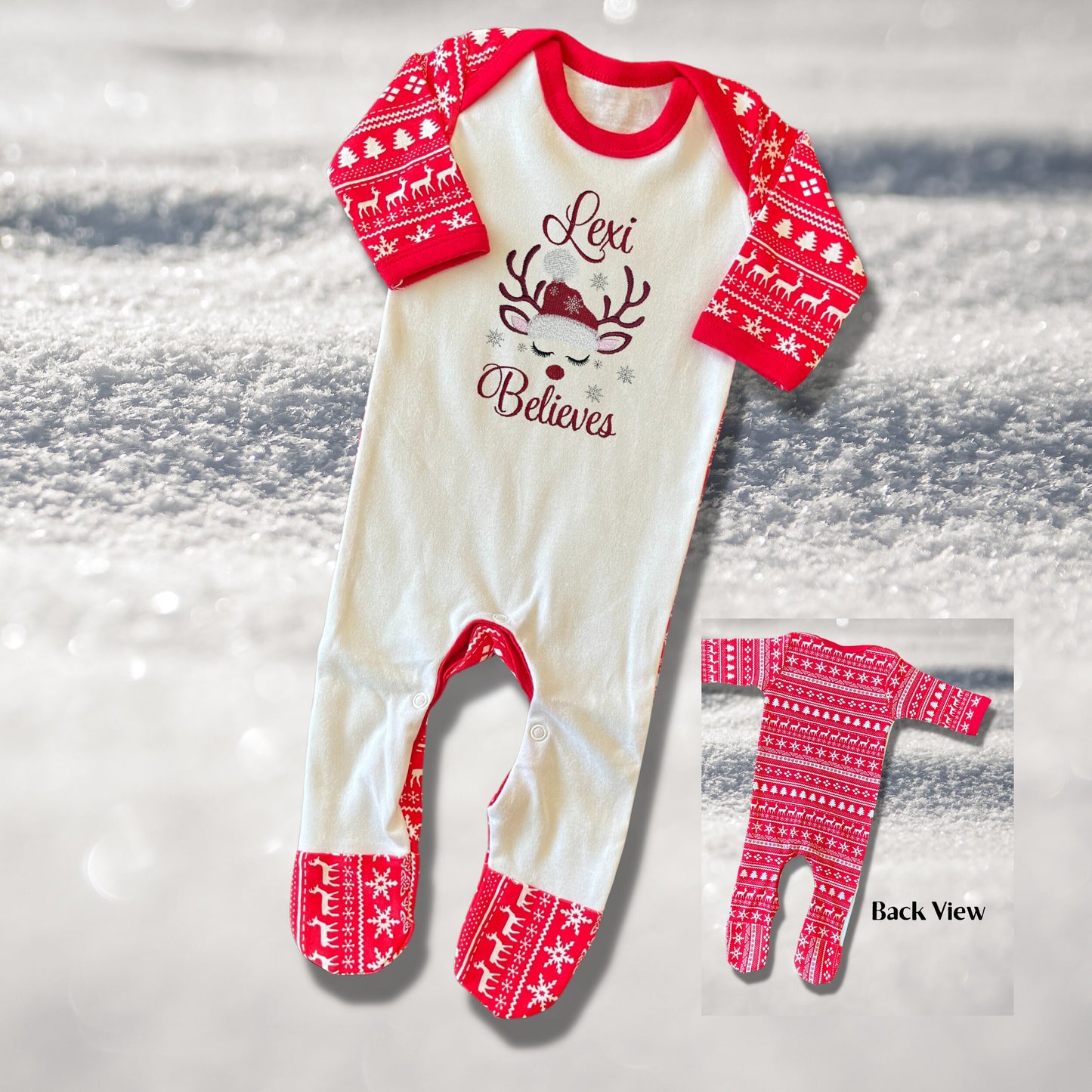 Personalised Embroidered Christmas Childrens Pyjamas and Rompersuits with a Gorgeous Winter Reindeer and the Words 'Believes' under the Name