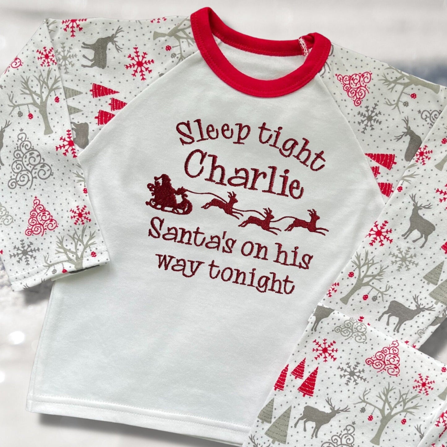 Personalised Embroidered Christmas Childrens Pyjamas and Rompersuits. Santa and His Sleigh. 'Santa's on his way'. A Perfect Christmas Gift