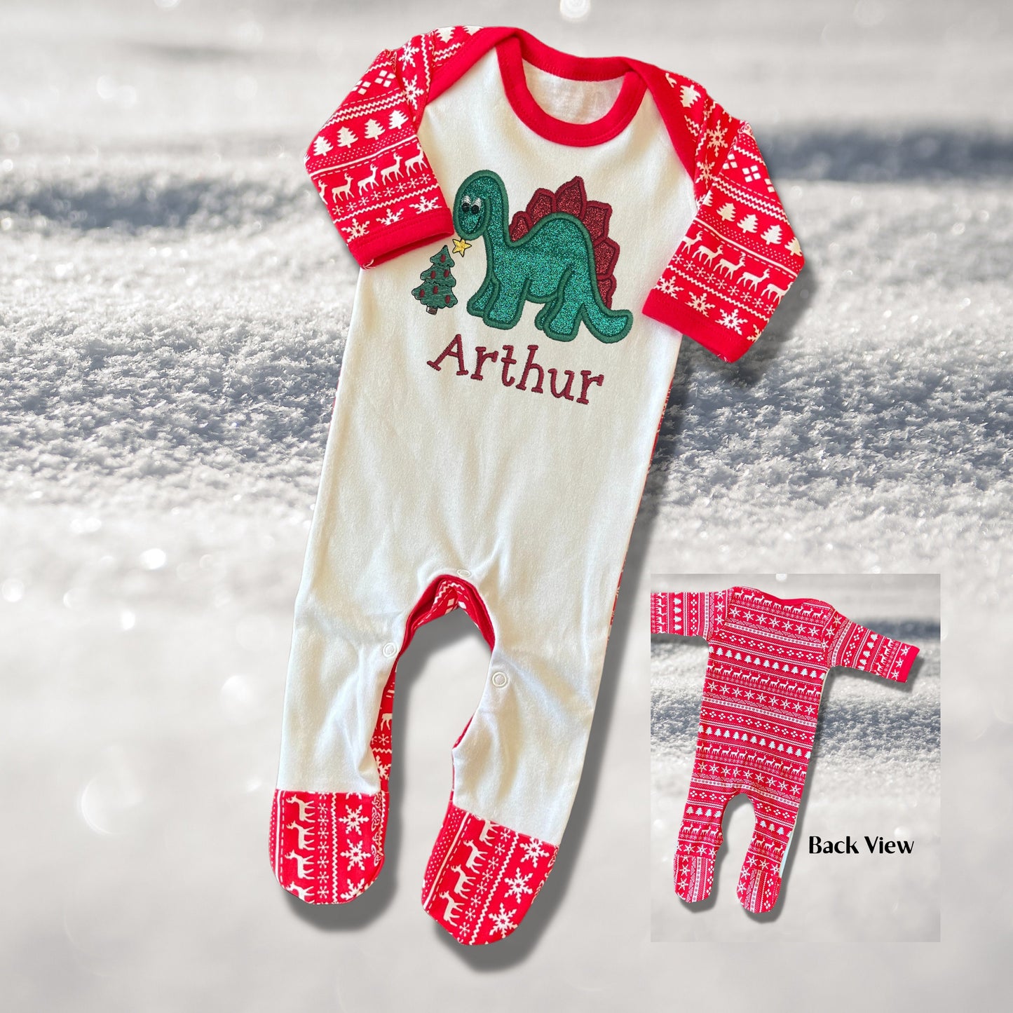 Personalised Embroidered Christmas Childrens Pyjamas and Rompersuits. Cute Dinosaur Putting a Star on his Tree. Finished with Child's Name