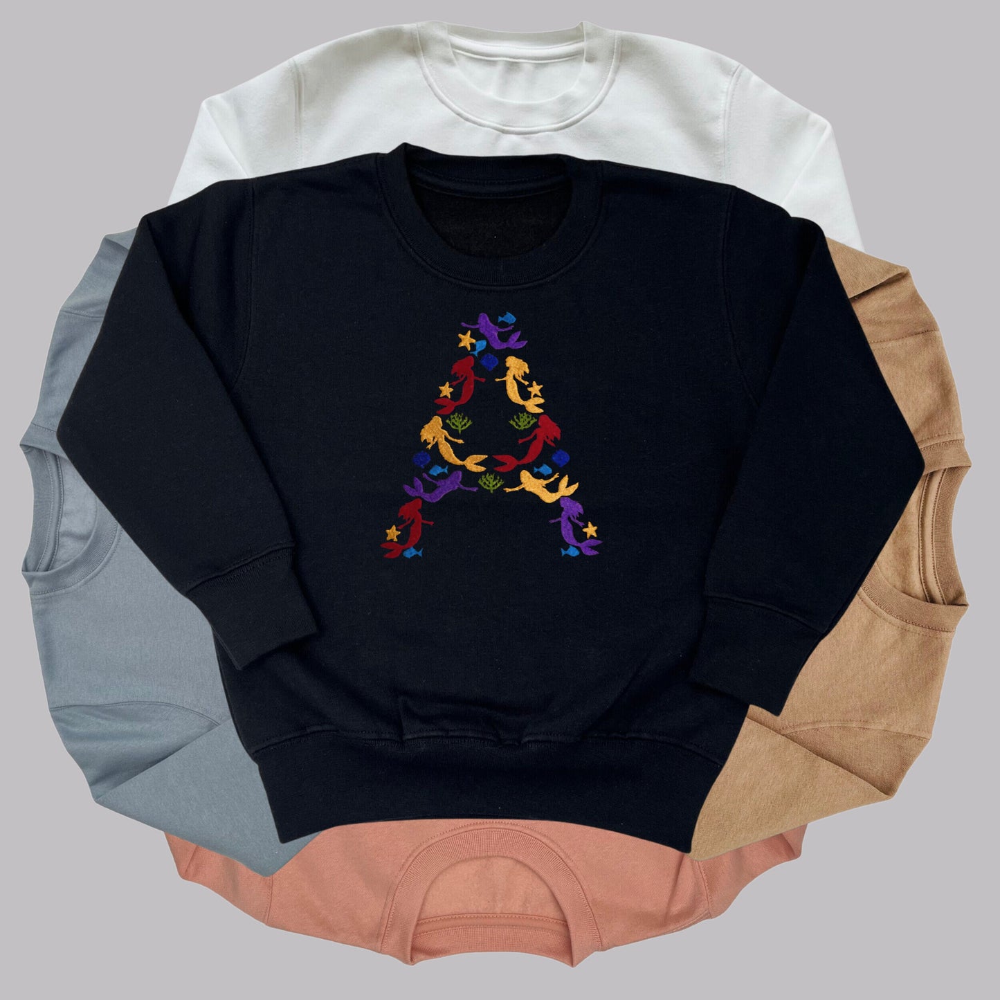 Children's Personalised Embroidered Top. Colourful Mermaids make up the Child's Initial. Perfect Gift for Children who Love Mermaids.