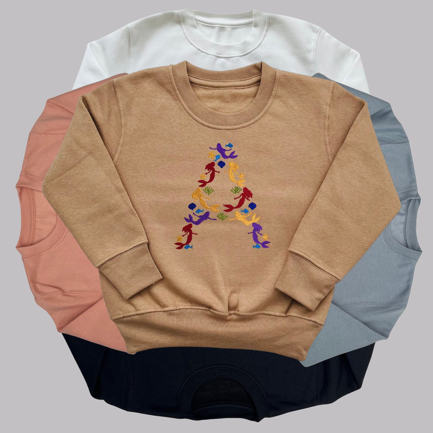 Children's Personalised Embroidered Top. Colourful Mermaids make up the Child's Initial. Perfect Gift for Children who Love Mermaids.
