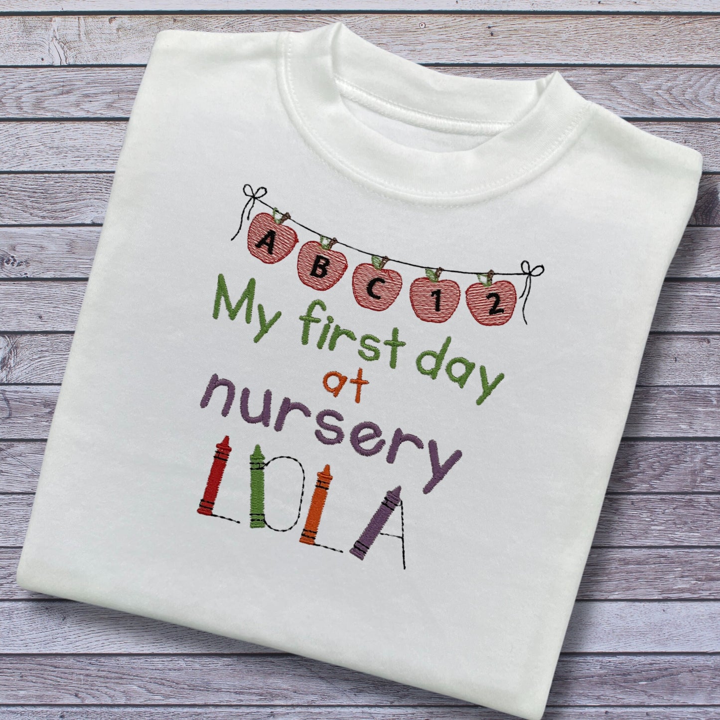 Personalised Embroidered 'My first day at nursery' Tops. Personalised with Child's Name in a Cute Colourful Crayon Font. Choice of Garment