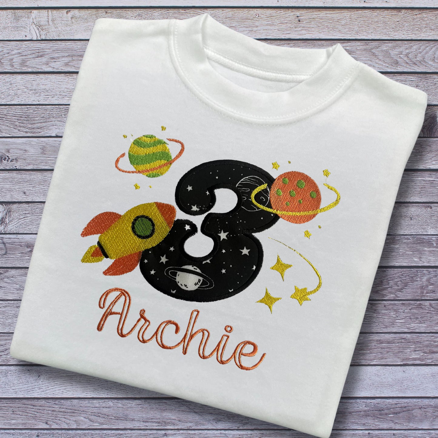 Personalised Embroidered Children's Birthday Top: Space Themed Rocket Design.
