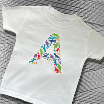 Personalised Embroidered Children's Dinosaur Top. Colourful Dinosaur's Make Up the Letter of the Alphabet. A Perfect Gift for Dinosaur Fans.