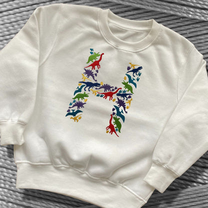 Personalised Embroidered Children's Dinosaur Top. Colourful Dinosaur's Make Up the Letter of the Alphabet. A Perfect Gift for Dinosaur Fans.