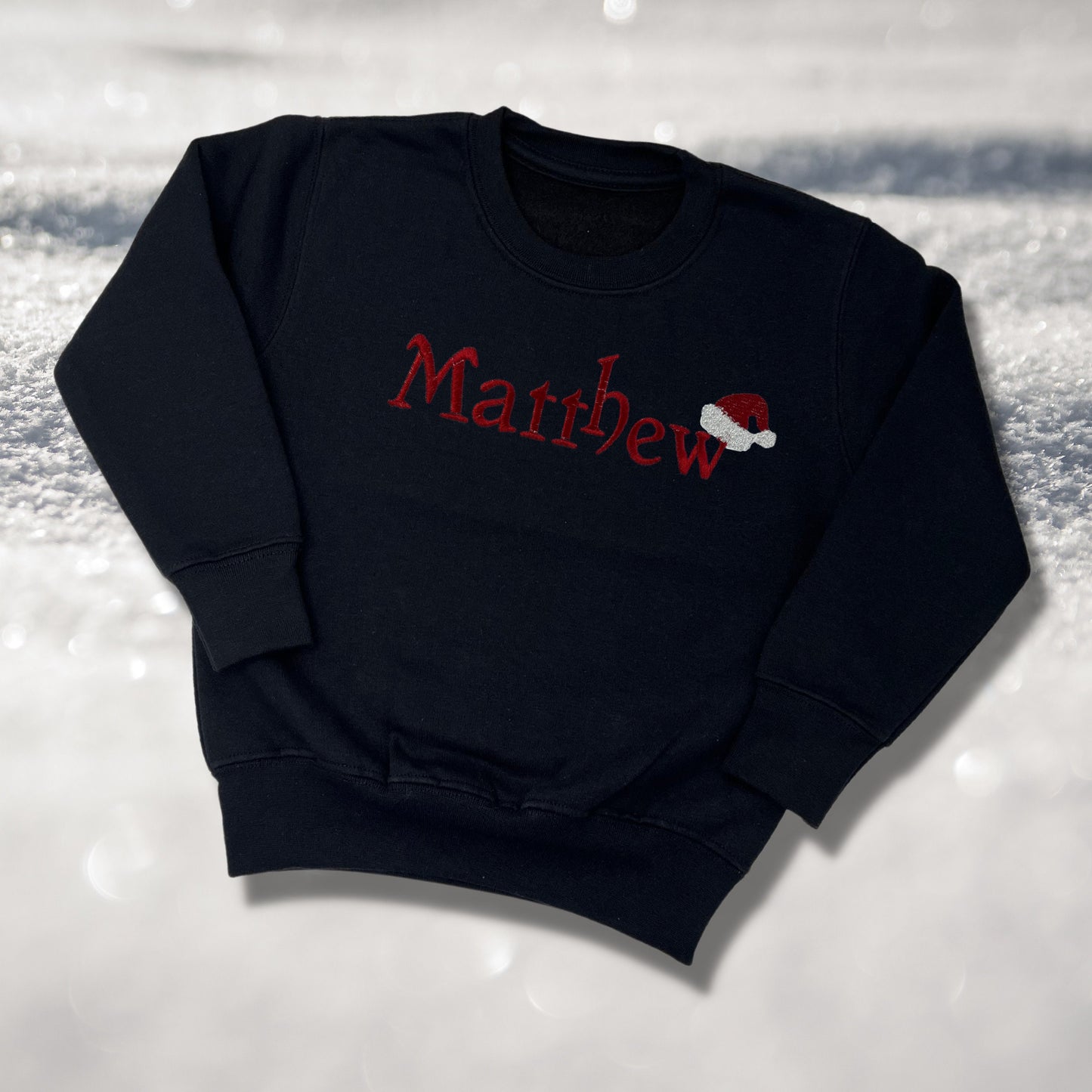Personalised Embroidered Childrens Christmas Top. Cute Design with Name and Santa Hat. Perfect for the Christmas Season. Choice of Garment
