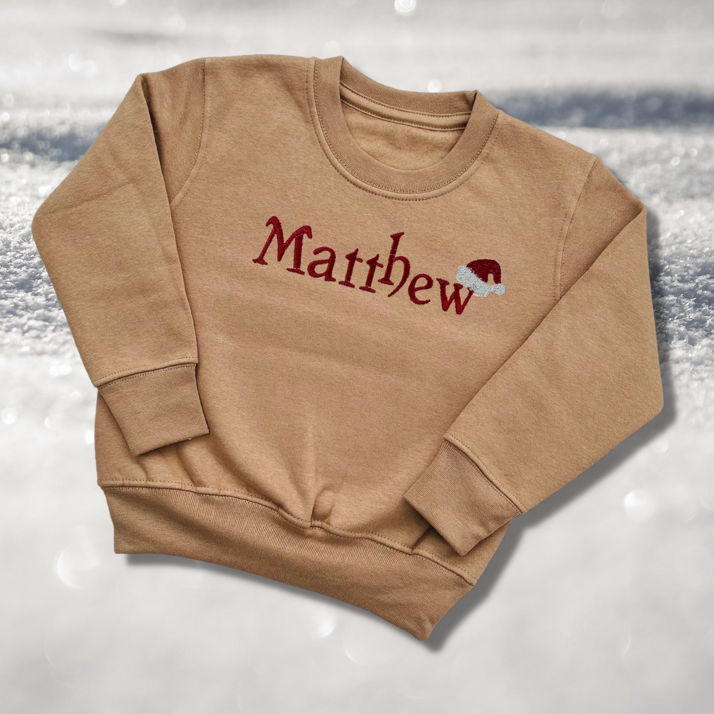 Personalised Embroidered Childrens Christmas Top. Cute Design with Name and Santa Hat. Perfect for the Christmas Season. Choice of Garment
