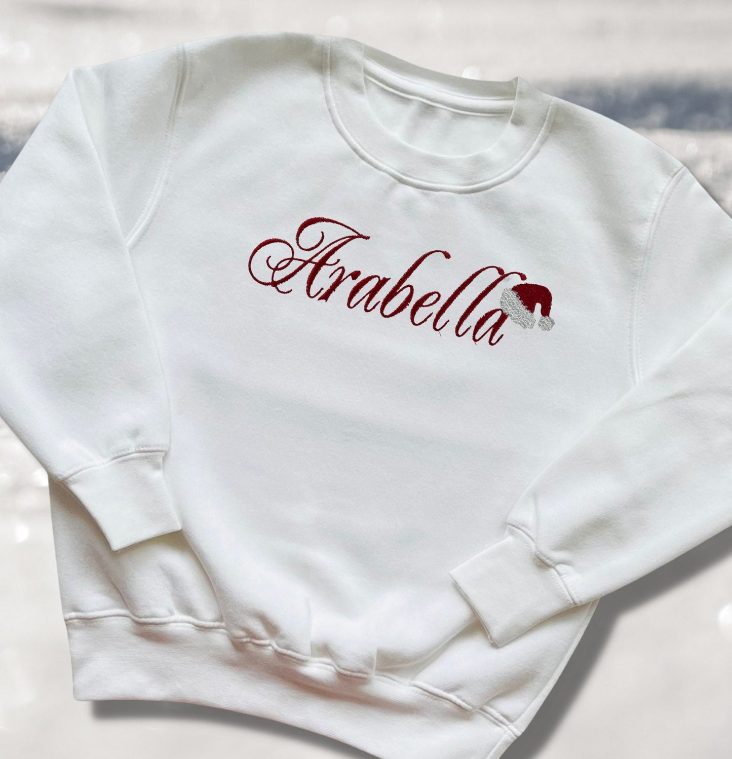 Personalised Embroidered Childrens Christmas Top. Cute Design with Name and Santa Hat. Perfect for the Christmas Season. Choice of Garment