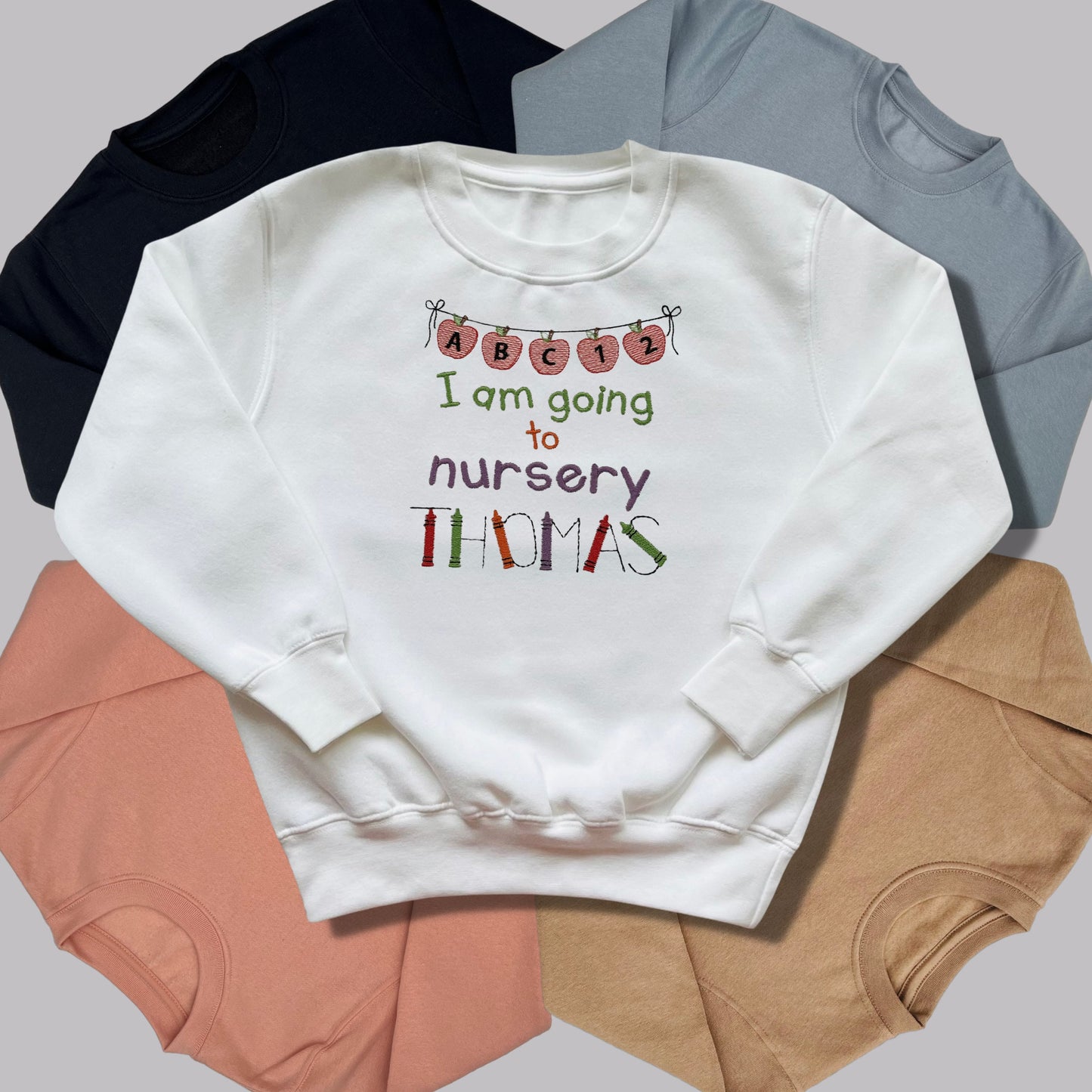 Personalised Embroidered 'I am going to nursery' Tops. Personalised with Child's Name in a Cute Colourful Crayon Font. Choice of Garment
