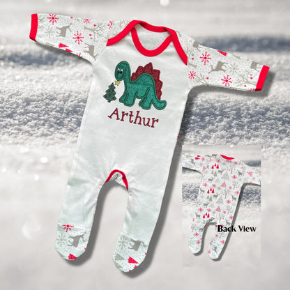 Personalised Embroidered Christmas Childrens Pyjamas and Rompersuits. Cute Dinosaur Putting a Star on his Tree. Finished with Child's Name