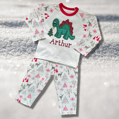 Personalised Embroidered Christmas Childrens Pyjamas and Rompersuits. Cute Dinosaur Putting a Star on his Tree. Finished with Child's Name