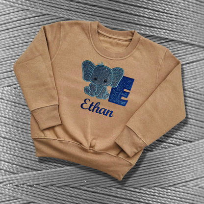 Children's Personalised Embroidered Top With a Cute Elephant Design. A Beautiful Design Using Glittery Blues with Child's Name and Initial