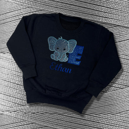 Children's Personalised Embroidered Top With a Cute Elephant Design. A Beautiful Design Using Glittery Blues with Child's Name and Initial