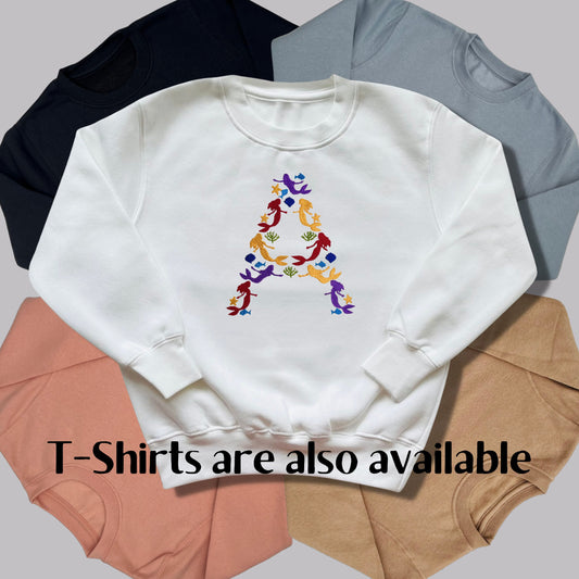 Children's Personalised Embroidered Top. Colourful Mermaids make up the Child's Initial. Perfect Gift for Children who Love Mermaids.