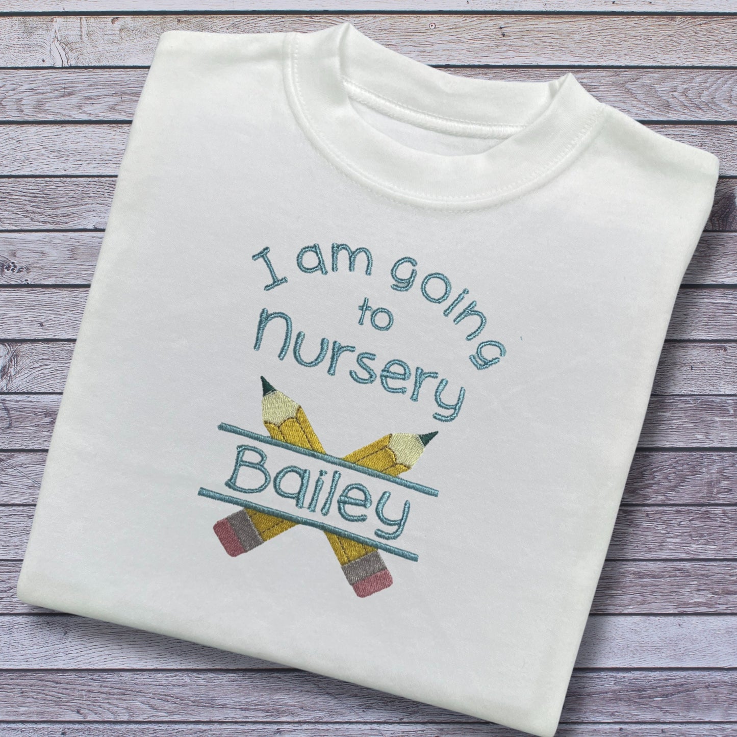 Personalised Embroidered 'I am going to nursery' Top. Cute Pencil Design in Blue or Pink Personalised with Child's Name. Choice of Garment.