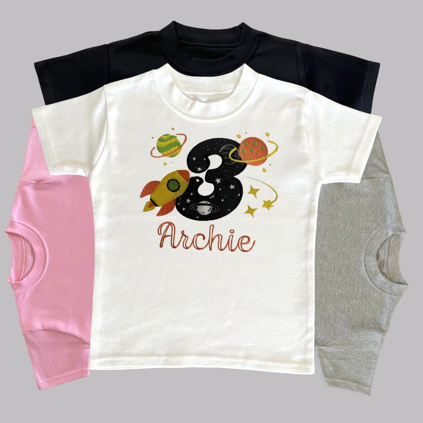 Personalised Embroidered Children's Birthday Top: Space Themed Rocket Design.